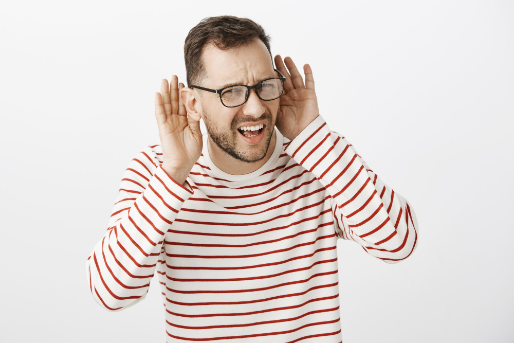 waist-up-shot-questioned-confused-caucasian-guy-black-glasses